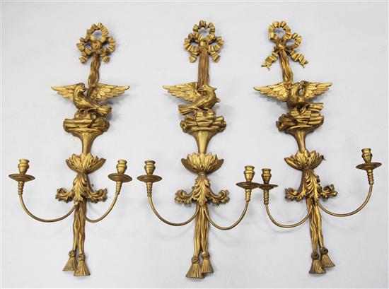 A set of three 18th century style carved giltwood wall lights, W.1ft 6in. H.3ft 9in.